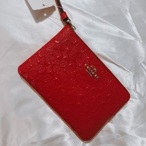 hot pink coach wristlet